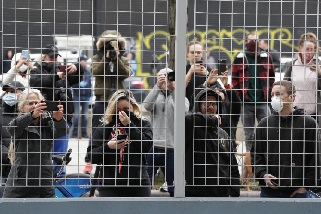 crowds-ignore-coronavirus-social-distancing-rules-to-watch-arrival-of-usns-comfort-hospital-ship-in-new-york