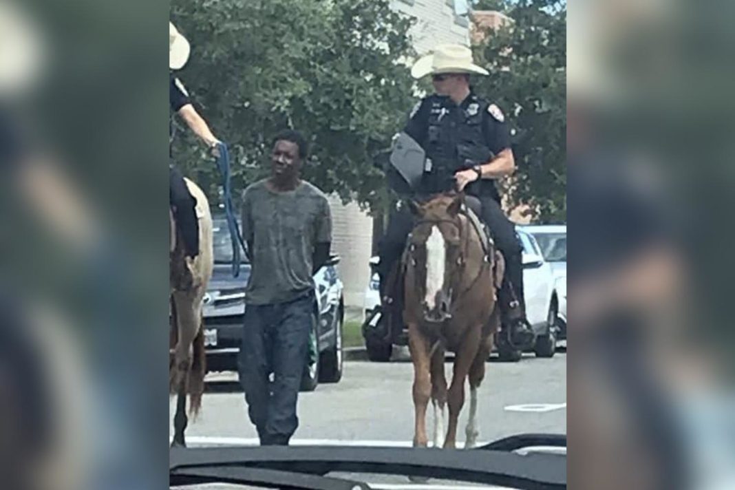 black-man-led-by-horse-mounted-officers-while-tied-to-a-rope-sues-police-for-$1million