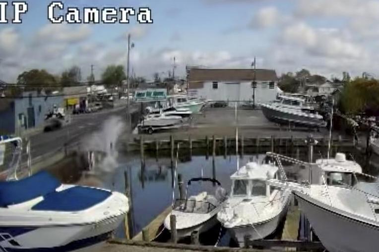 incredible-footage-shows-elderly-couple-being-rescued-from-car-after-it-crashed-into-canal-and-began-sinking