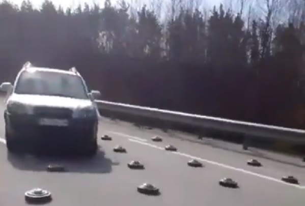 watch:-ukrainian-soldiers-‘kick-away’-highly-explosive-land-mines-from-a-road