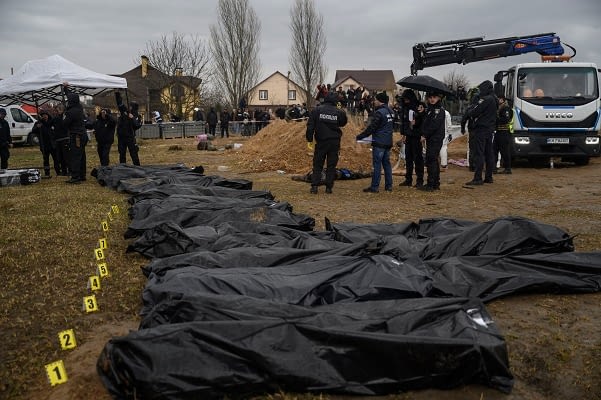 dead-decomposed-bodies-of-civilians-in-mariupol-chucked-in-craters-with-‘dogs-or-birds-eating-their-faces’